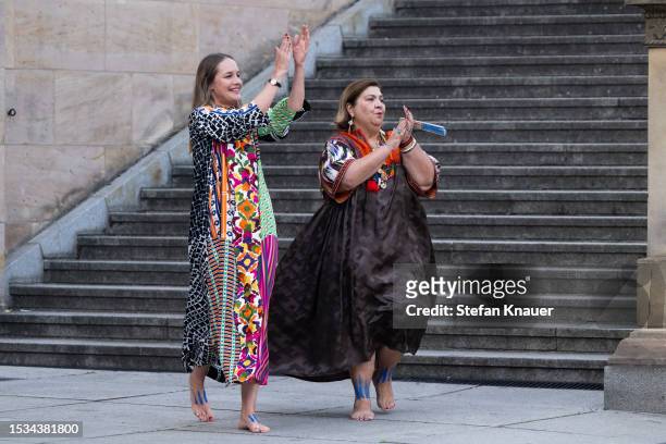 Designers Nina Kuhn and Rianna Kounou acknowledge the applause of the audience at the Rianna+Nina X NEWEST runway show during the Berlin Fashion Week...