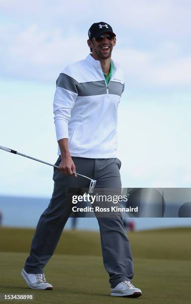 Michael Phelps reacts after putting on the nineth green during the second round of The Alfred Dunhill Links Championship at Kingsbarns Golf Links on...