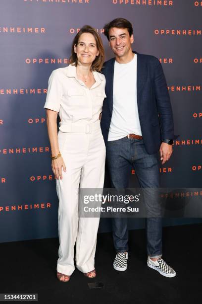 Claire Fournier and Julian Bugier attend the "Oppenheimer" premiere at Cinema Le Grand Rex on July 11, 2023 in Paris, France.