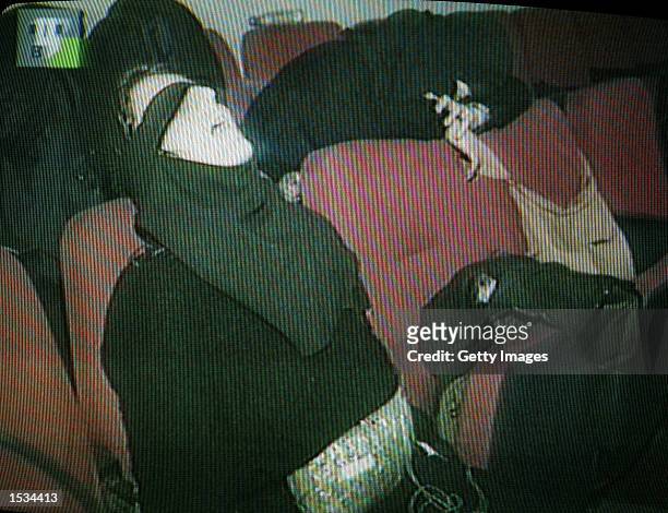 This video capture from Russian television shows a dead Chechen female rebel inside the theater where hundreds hostages were held by the rebels...