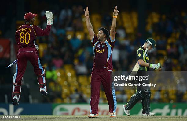 Ravi Rampaul of the West Indies celebrates with Denesh Ramdin after dismissing Mitchell Starc of Australia during the ICC World Twenty20 2012 Semi...