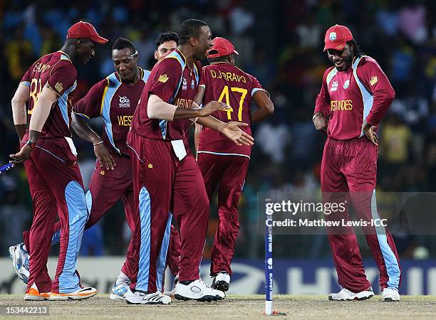 Chris Gayle of the West Indies dances with his team mates, after defeating Australia during the ICC World Twenty20 2012 Semi Final match between...