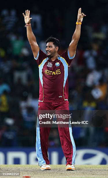 Ravi Rampaul of the West Indies celebrates bowling Mitchell Starc of Australia during the ICC World Twenty20 2012 Semi Final match between Australia...