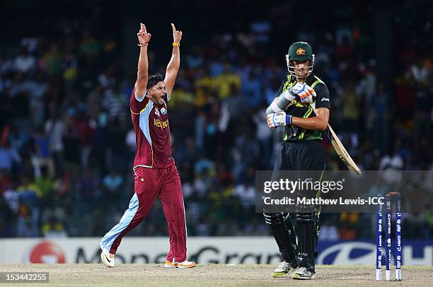 Ravi Rampaul of the West Indies celebrates bowling Mitchell Starc of Australia during the ICC World Twenty20 2012 Semi Final match between Australia...