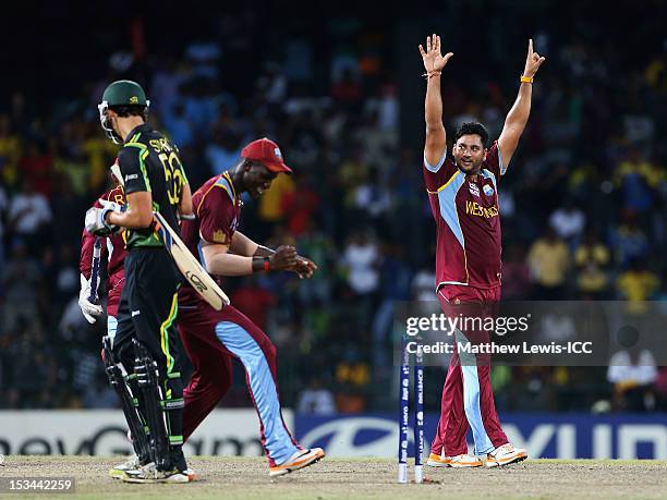 Ravi Rampaul of the West Indies celebrates bowling Mitchell Starc of Australia during the ICC World Twenty20 2012 Semi Final match between Australia...