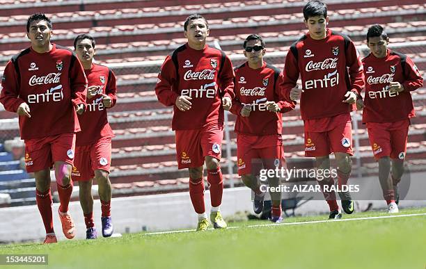 Bolivian players Luis Mendez, Alejandro Melean, Ronald Segovia, Jhasmani Campos, Miguel Suarez and Ruddy Cardozo, jog during a training session in La...