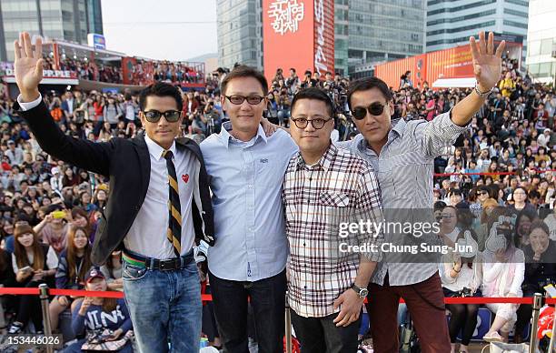 Actor Aaron Kwok, director Sunny Luk, Leung Longman and actor Tony Leung Ka-Fai attend the Outdoor Greeting during the 17th Busan International Film...