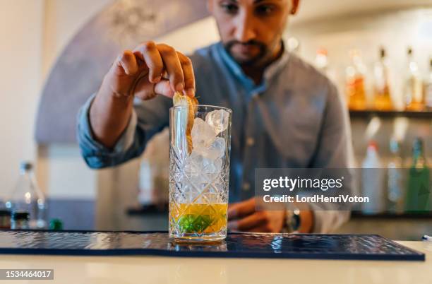 bartender making cocktail - malta business stock pictures, royalty-free photos & images