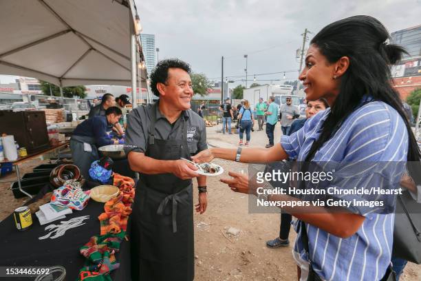 Chef Hugo Ortega handed out Tamales de Huitlacoche over Crema de Elote during the fourth annual Southern Smoke, a culinary event celebrating barbecue...