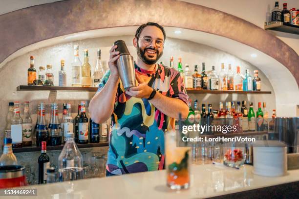 bartender making cocktail - shaking stock pictures, royalty-free photos & images