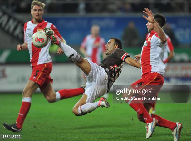 Mahir Saglik of St Pauli is challenged byMarc Pfertzel of Berlin during the second Bundesliga match between FC St. Pauli and 1. FC Union Berlin at...