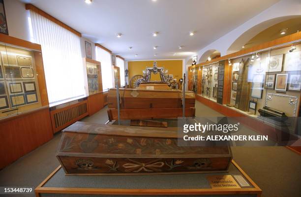 Coffins are seen at the Funeral museum of Vienna on October 4, 2012. Fascinated by contraception, chimneysweeps, or magic boxes? Vienna has a museum...