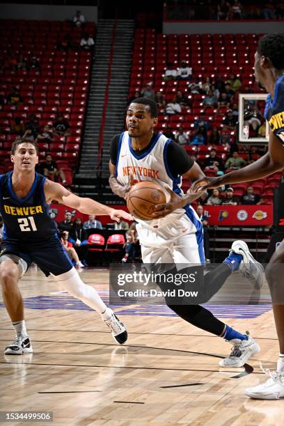 Michael Foster Jr. #27 of the New York Knicks dribbles the ball during the game against the Denver Nuggets during the 2023 NBA Summer League in Las...