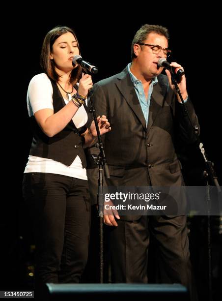 Vince Gill and his daughter perform on stage at the Children's Health Fund 25th Anniversary Concert at Radio City Music Hall on October 4, 2012 in...