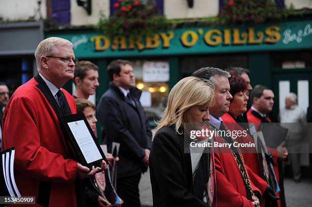 Locals watch a procession led by Mayor of Drogheda Paul Bell on their way to the Memorial Service for murdered journalist Jill Meagher at St. Peter's...