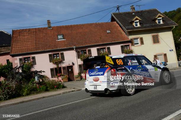 Yvan Muller of France and Guy Leneveu of France compete in their Mini John Cooper Works WRC during Day One of the WRC Rally of France on October 05,...