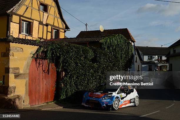 Mads Ostberg of Norway and Jonas Andersson of Sweden compete in their Adapta WRT Ford Fiesta RS WRC during Day One of the WRC Rally of France on...