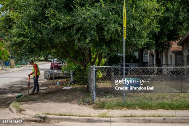 Construction worker stands in the shade on July 11, 2023 in Austin, Texas. Record-breaking temperatures continue soaring as prolonged heatwaves sweep...