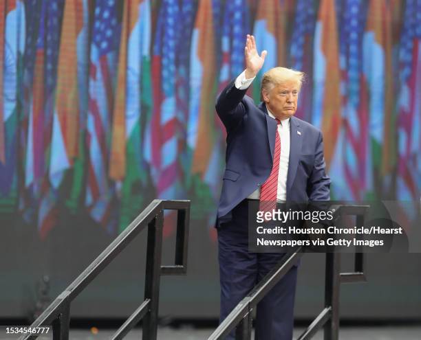 President Donald Trump waves as he leaves the stage during the Howdy Modi event at NRG Stadium Sunday, Sept. 22 in Houston.