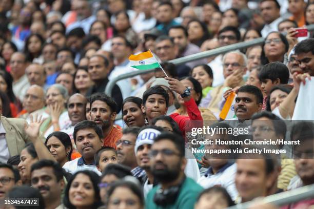 Young supporter of India's prime minister, Narendra Modi waves a flag during the Howdy Modi event at NRG Stadium Sunday, Sept. 22 in Houston.