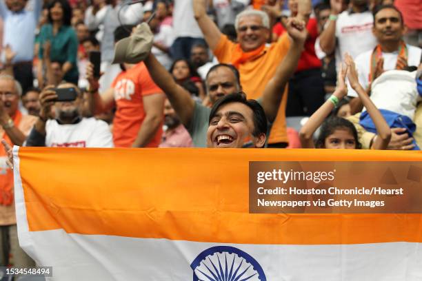 Supporters of India's prime minister, Narendra Modi cheer during the Howdy Modi event at NRG Stadium day, Sept. 22 in Houston.