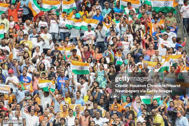 Supporters of India's prime minister, Narendra Modi cheer during the Howdy Modi event at NRG Stadium day, Sept. 22 in Houston.