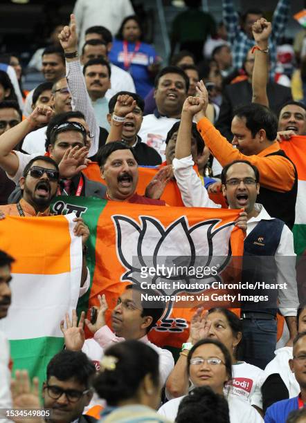 Supporters of India's prime minister, Narendra Modi cheer during the Howdy Modi event at NRG Stadium day, Sept. 22 in Houston.