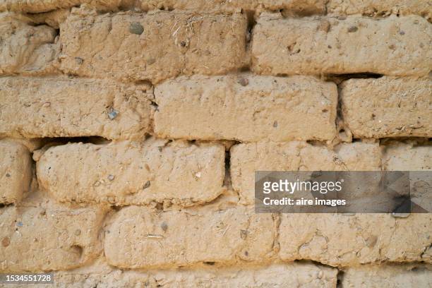 close-up of an earth slope wall on the exterior of a building or structure, frontal view - abandoned crack house stock pictures, royalty-free photos & images