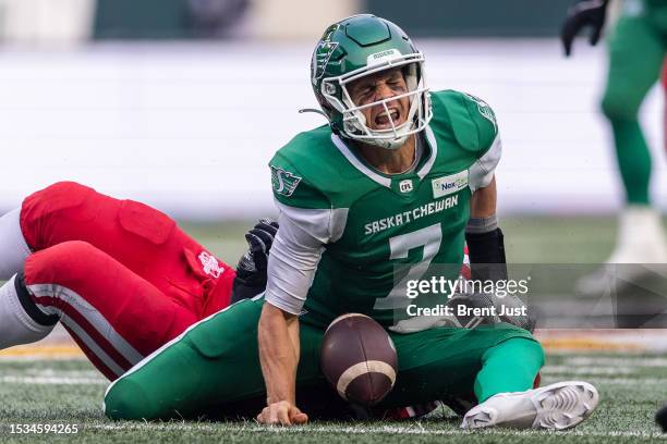 Trevor Harris of the Saskatchewan Roughriders suffers an injury to his leg on this tackle in the game between the Calgary Stampeders and Saskatchewan...