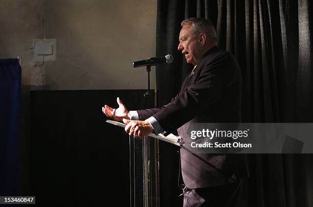 Former Wisconsin Governor and current Republican candidate for the state's U. S. Senate seat Tommy Thompson speaks to workers and guests before a...