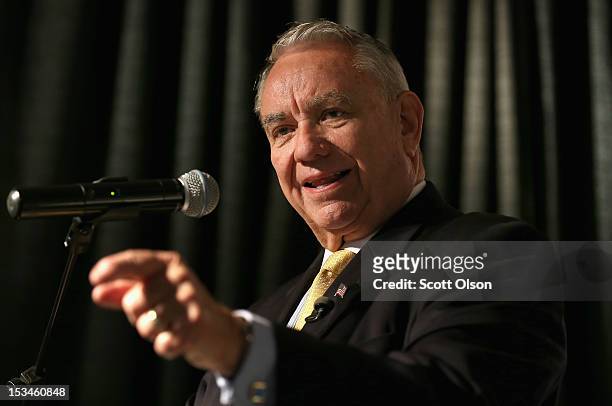 Former Wisconsin Governor and current Republican candidate for the state's U. S. Senate seat Tommy Thompson speaks to workers and guests before a...