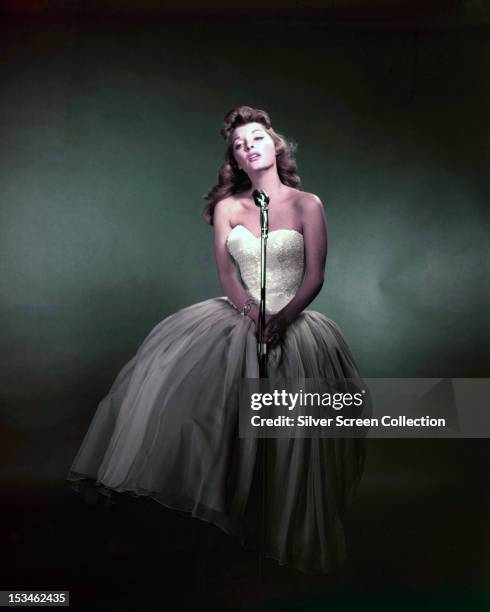 American singer and actress Julie London performing, circa 1955.