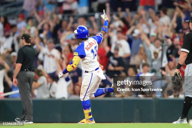 Atlanta Braves right fielder Ronald Acuna, Jr. Signals to the fans after hitting a home run in the bottom of the ninth inning during the Saturday...