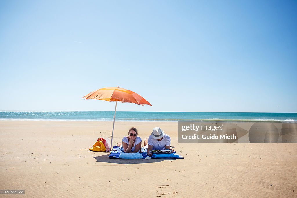 Couple under sunshade