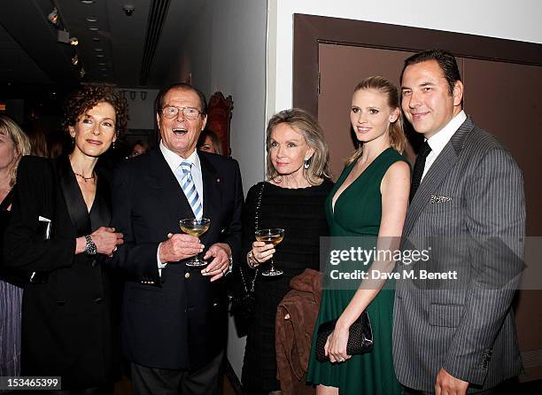 Deborah Moore, Sir Roger Moore, Christina Tholstrup, Lara Stone and David Walliams attend '50 Years Of James Bond: The Auction', celebrating the 50th...