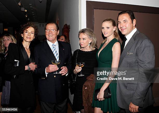 Deborah Moore, Sir Roger Moore, Christina Tholstrup, Lara Stone and David Walliams attend '50 Years Of James Bond: The Auction', celebrating the 50th...
