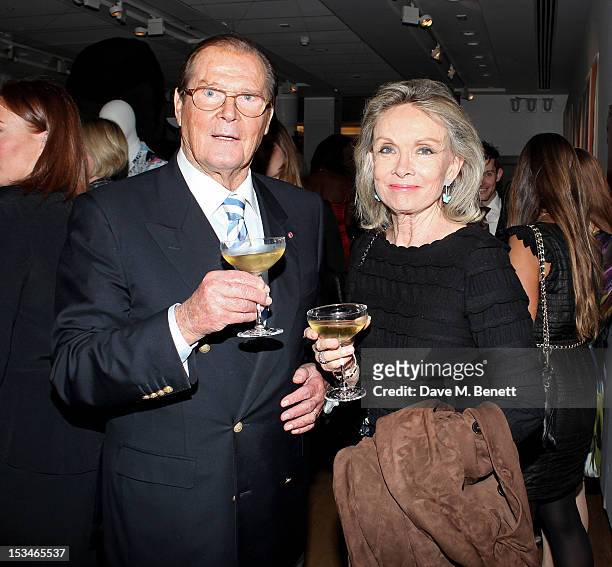 Sir Roger Moore and Christina Tholstrup attend '50 Years Of James Bond: The Auction', celebrating the 50th anniversary of the film franchise and the...