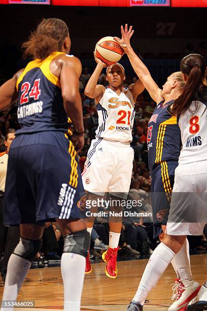 Renee Montgomery of the Connecticut Sun shoots against Tamika Catchings of the Indiana Fever during Game One of the Eastern Conference Finals on...