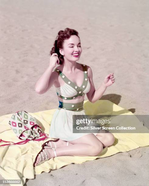 American actress and singer Ann Blyth wearing a two-piece beach outfit, circa 1950.