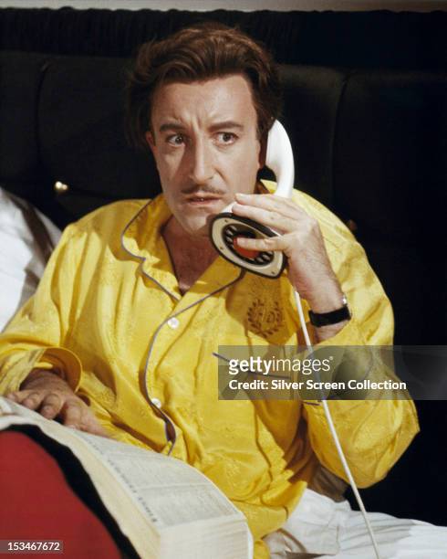 English actor Peter Sellers , as concert pianist Henry Orient, takes an alarming phone call in 'The World of Henry Orient', directed by George Roy...