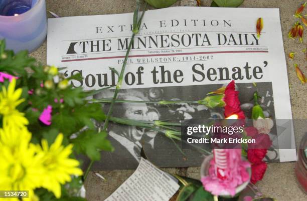 An edition of the University of Minnesota newspaper lies on the ground at a make-shift memorial outside the campaign headquarters of U.S. Senator...