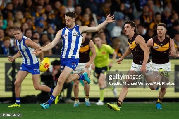 Lachie Young of the Kangaroos kicks the ball during the 2023 AFL Round 18 match between the North Melbourne Kangaroos and the Hawthorn Hawks at...