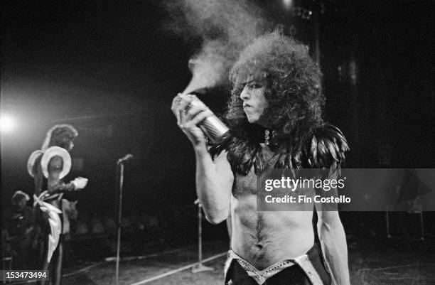 16th MAY: Guitarist Paul Stanley from American rock group Kiss sprays his hair with a can of hairspray on stage at Cobo Hall in Detroit during the...