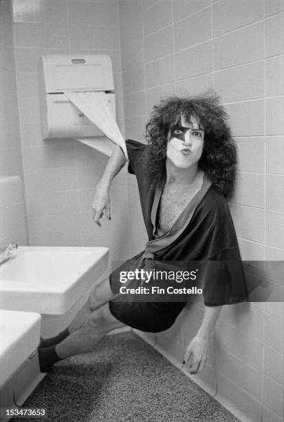 16th MAY: Guitarist Paul Stanley from rock group Kiss posed leaning from a towel dispenser backstage at Cobo Hall in Detroit during the concert...