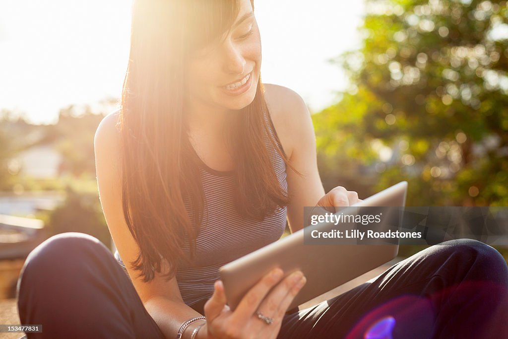 Girl engaging with tablet computer