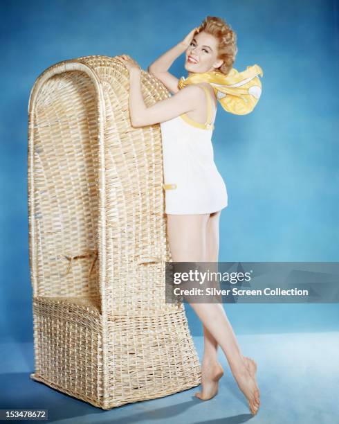 American actress Sheree North in a white, one piece swimsuit, circa 1955.