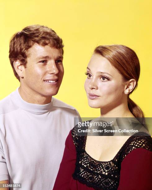 American actors Ryan O'Neal and Leigh Taylor-Young, circa 1966. They play Rodney Harrington and Rachel Welles in the ABC soap opera 'Peyton Place'.