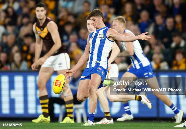 Harry Sheezel of the Kangaroos kicks the ball during the 2023 AFL Round 18 match between the North Melbourne Kangaroos and the Hawthorn Hawks at...