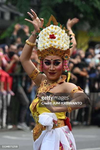 Balinese dancers perform a Jagad Mangupura dance during the Surabaya Cross Culture International Folk Art Festival in Surabaya on July 16, 2023.