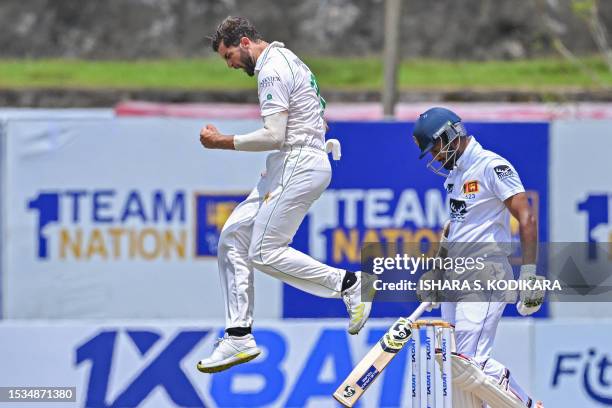 Pakistan's Shaheen Afridi celebrates after taking the wicket of Sri Lanka's captain Dimuth Karunaratne during the first day of the first cricket Test...